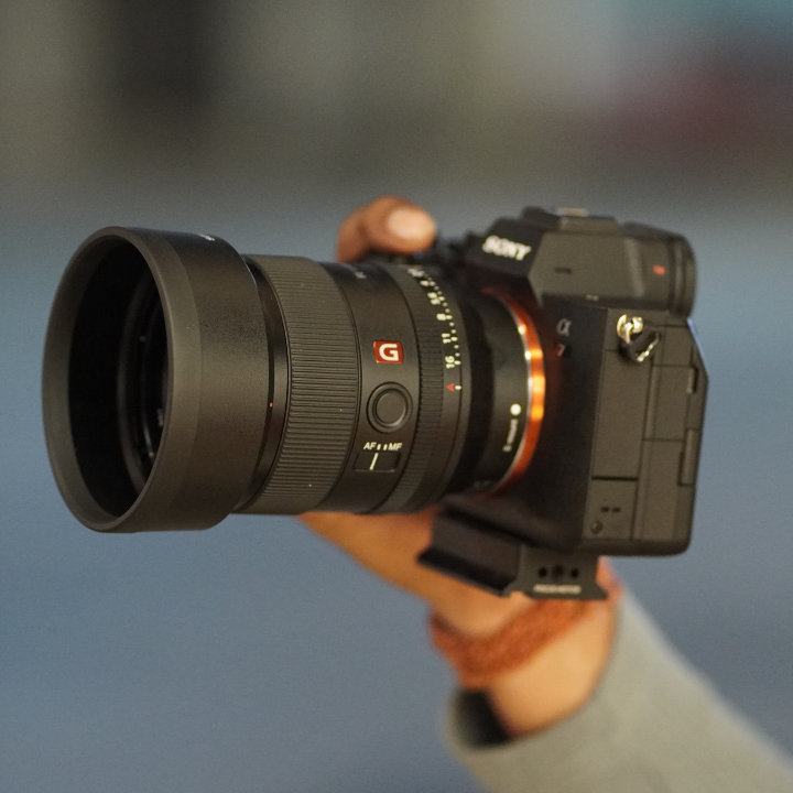 A person holding Sony alpha 7 camera