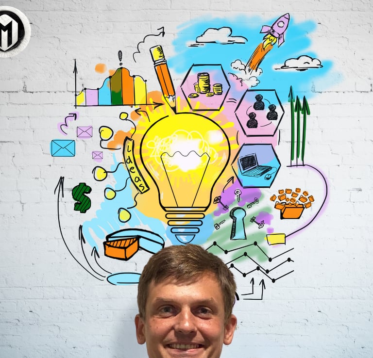 a man standing in front of a wall with a light bulb