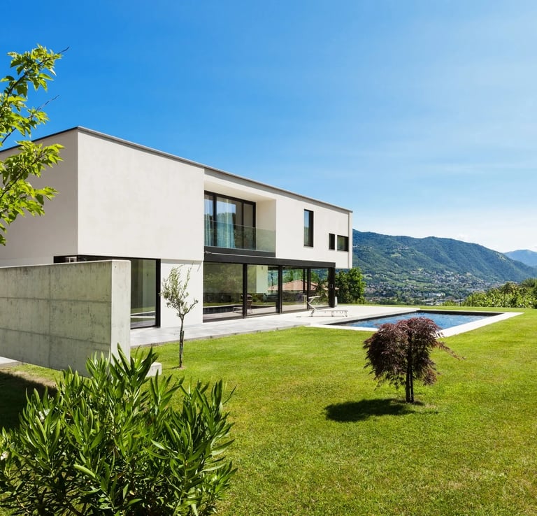 a house with a pool and a pool in the background