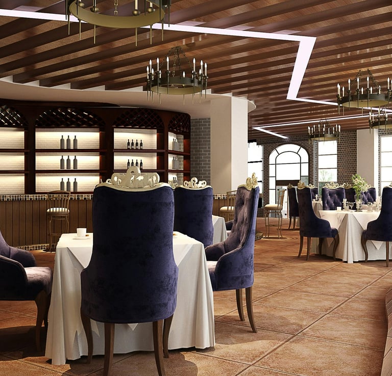 Restaurant interior with dining tables, purple chairs, a bar, and chandeliers.