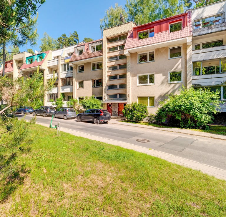 a street scene with a car parked on the side of the road