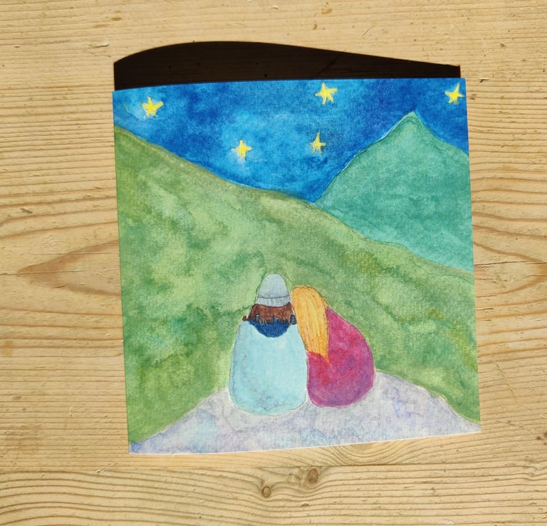 a queer greetings card of a couple in the mountains