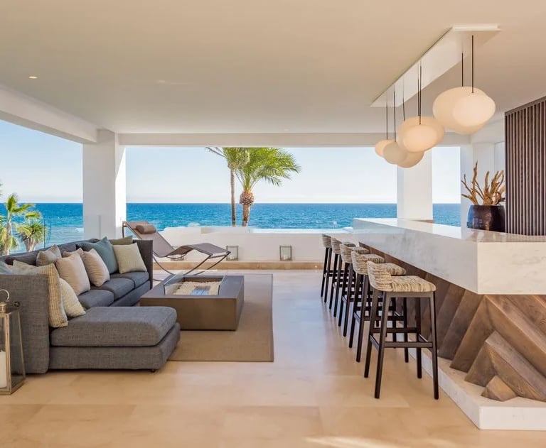 Covered terrace lounge and bar overlooking the Mediterranean