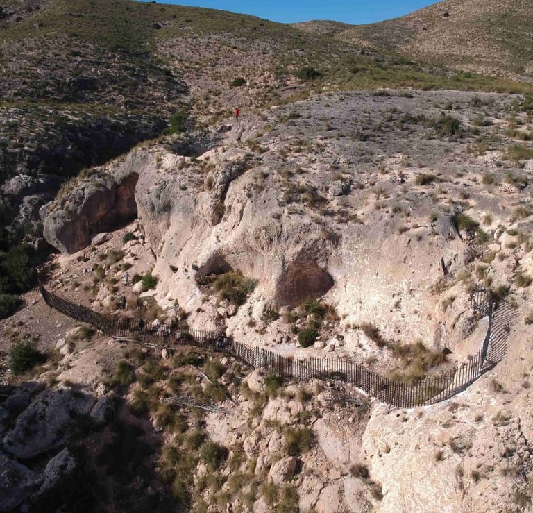 A group of caves known as the Arco Caves, in the Almadenes Canyon. Photo by cieza.es.