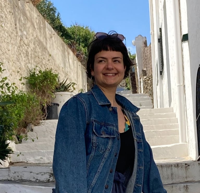 a woman in a denim jacket and jeans jacket