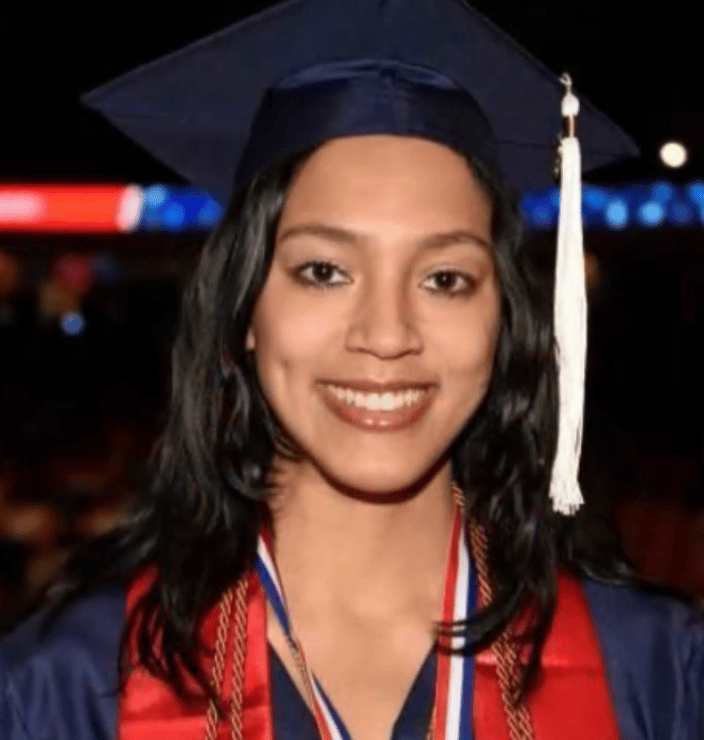 Headshot of Taylor Guy in a graduation cap and gown.