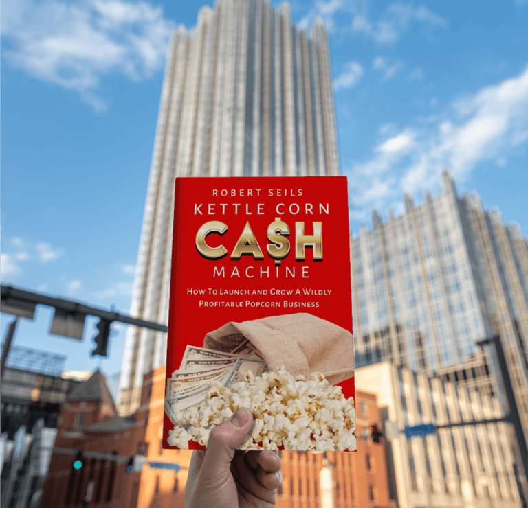 a person holding a book about cash machine