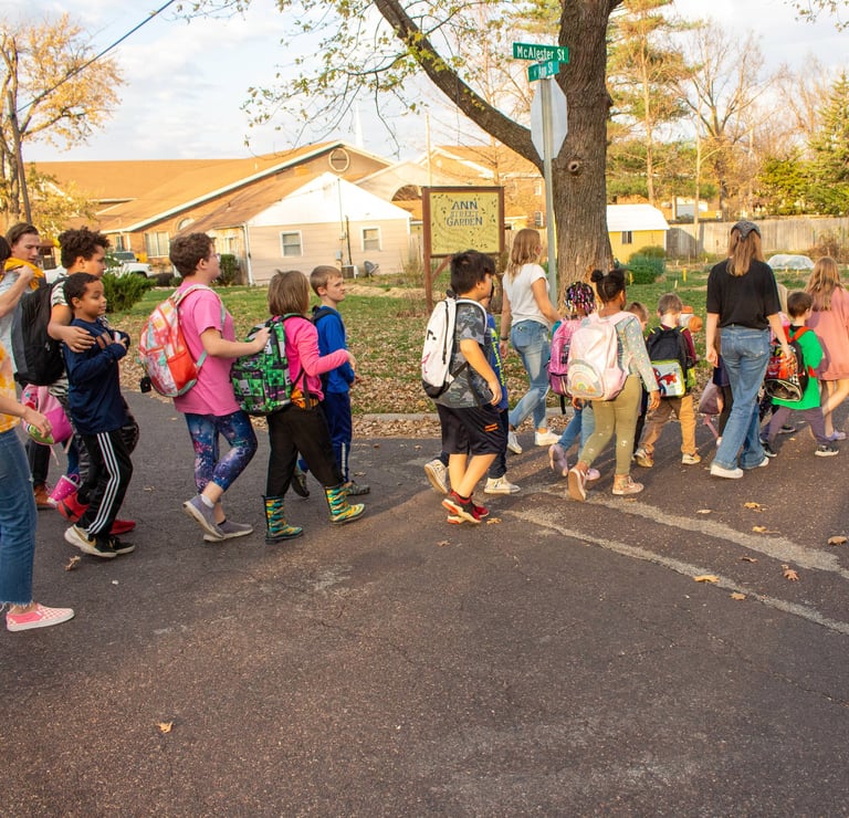The Benton students walking in a line to Access Arts from school.