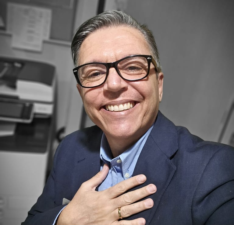 a man in a suit and tie smiling