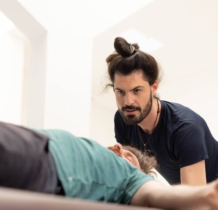 Practitioner joyfully focused on the client breathing and communicating through words and touch