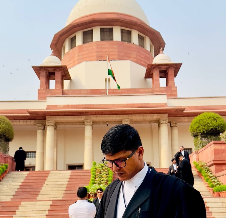 An Advocate in a suit and robe is standing in front of Supreme Court of India