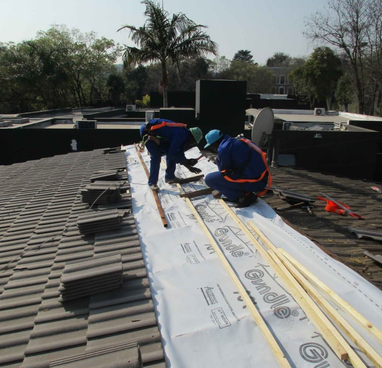 Environmental Pro Construction team installing underlay and battens during a tile roof replacement 