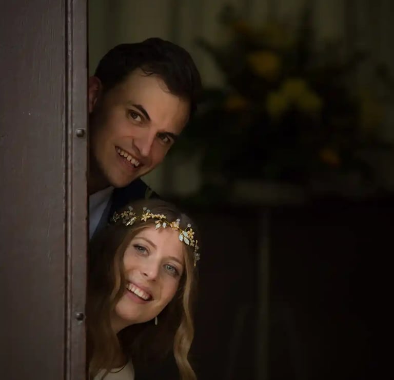 a man and woman standing in a doorway