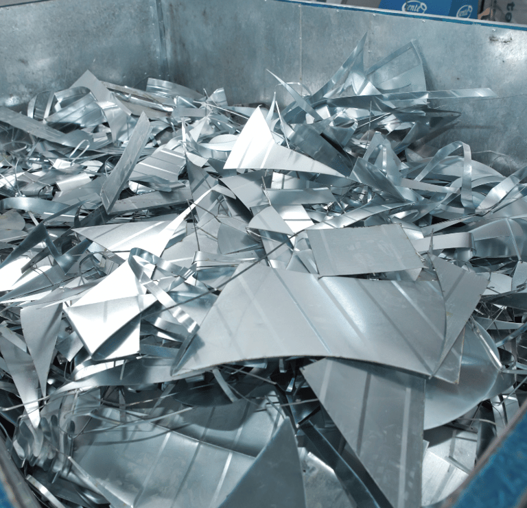 a metal container filled with metal foil 