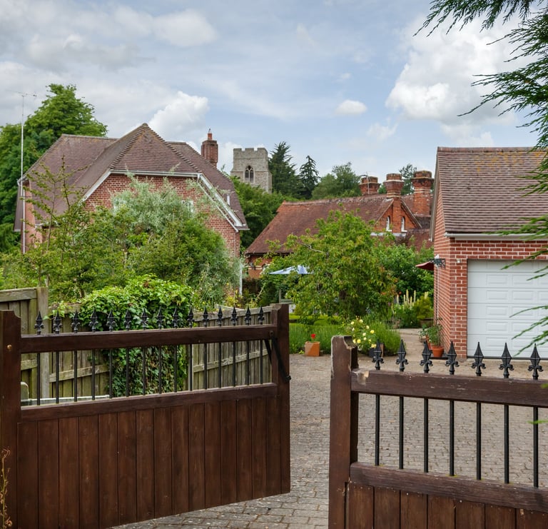 A double set of wooden gates swinging open by automation