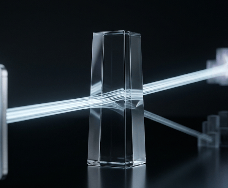 A beam of light refracting through a glass prism and splitting into data streams on a dark background.