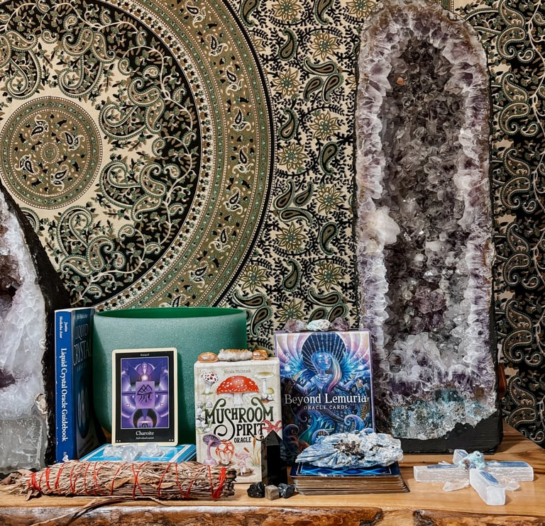 a table with a bunch of crystals and oracle tarot cards