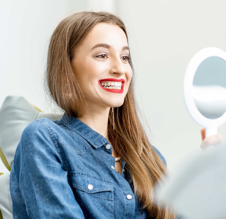 a woman with a smile on her face and a mirror in front of her
