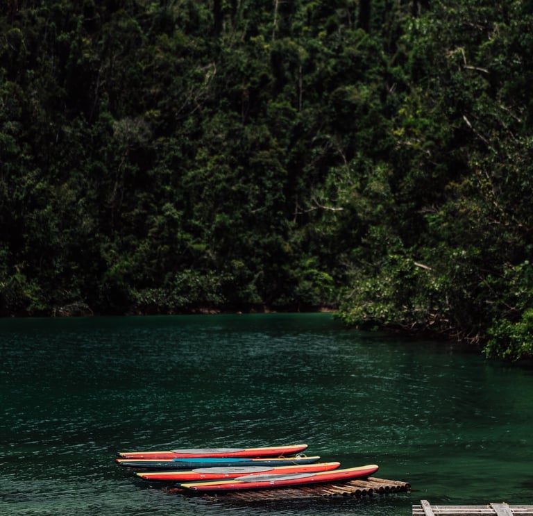 a boat is docked at a dock with a boat in the water
