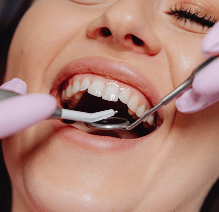 Dental surgeon performing gum surgery to treat gum disease and restore healthy gum tissue