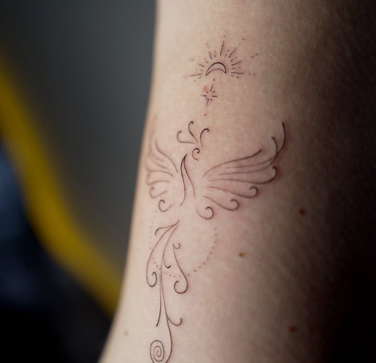 fineline tattoo brazo fenix cusco peru