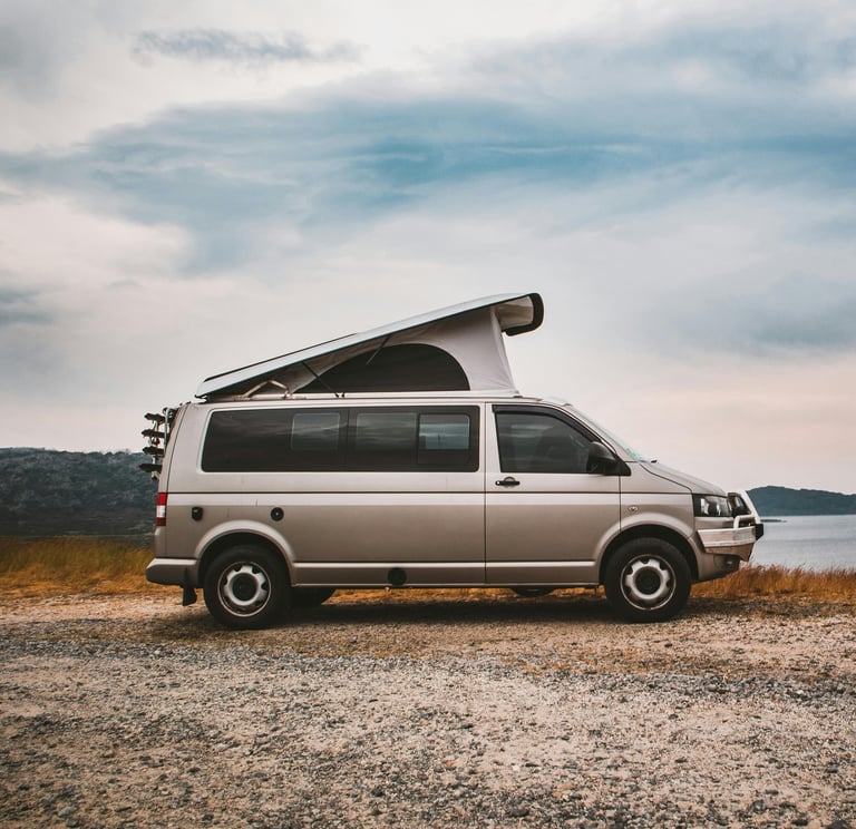 Modern campervan near lake