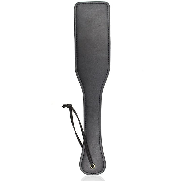 a faux leather paddle for bdsm play