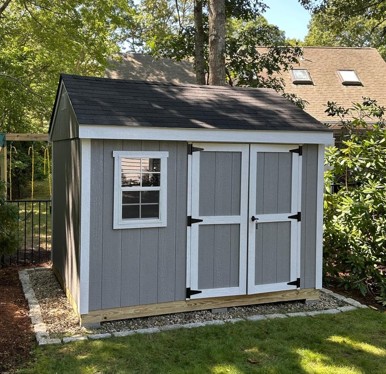 Custom 8x10 wooden shed with double doors and window, built in Halifax, Massachusetts for functional backyard storage.