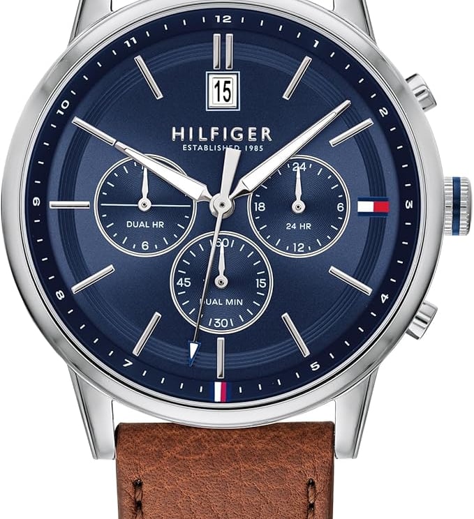 Tommy Hilfiger men's chronograph watch with a navy blue dial and brown leather strap.