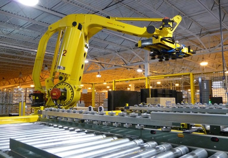 a space where there are industrial machines, with belts, couplings, bearings, industrial hoses