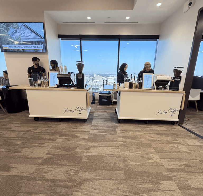 Friday Coffee mobile espresso bar setup in a modern office with baristas serving drinks