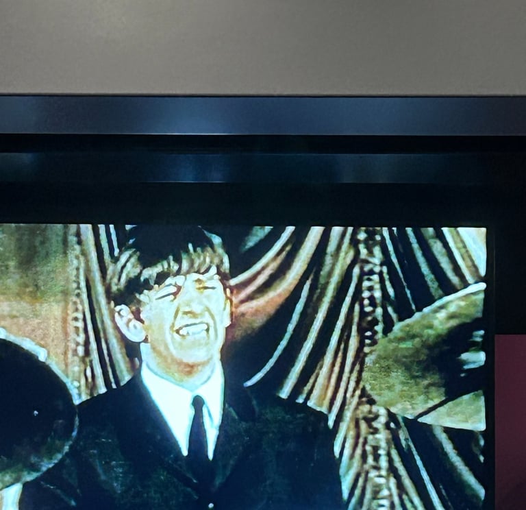 A picture of the Rock and Roll Hall of Fame exhibit on the Beatles.