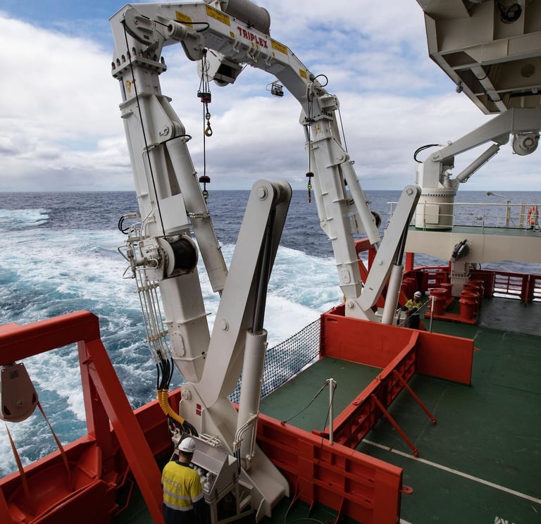 shipboard crane being inspected