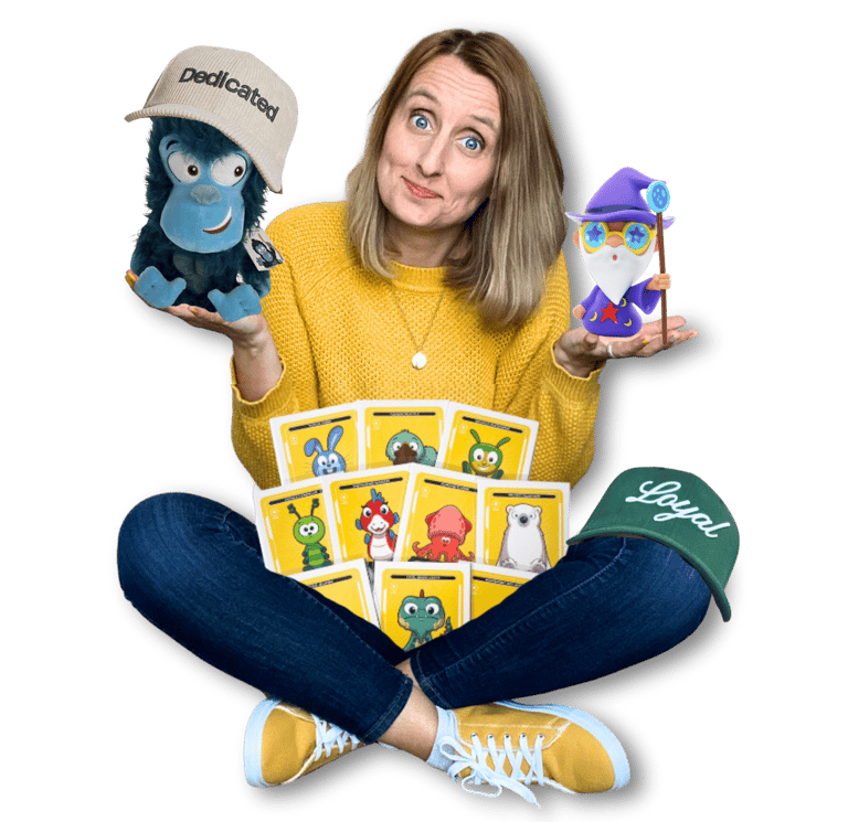 Anne Bagg holding physical Veefriends collectibles like friendscaps, plushies, trading cards, figure