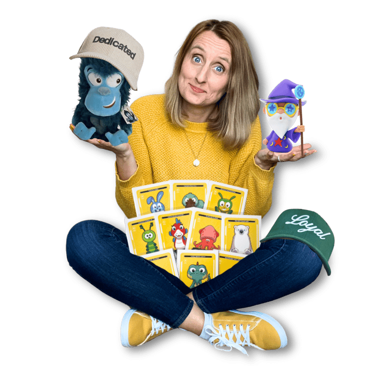 Anne Bagg holding physical Veefriends collectibles like friendscaps, plushies, trading cards, figure