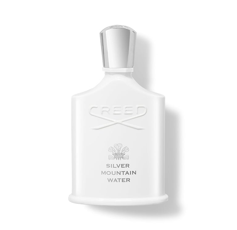 Creed Silver Mountain Water luxury fragrance bottle with a white finish and silver cap.