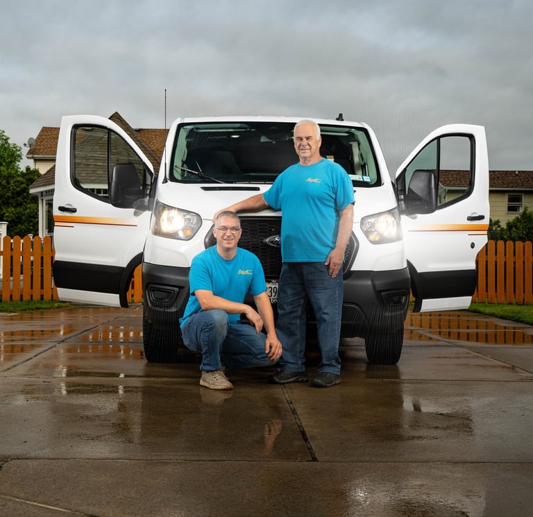 John and Dave in front of their service truck