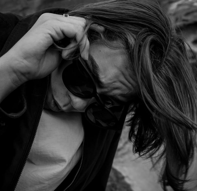 a man with a camera and sunglasses on