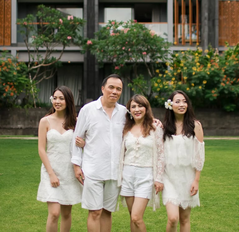 Janice family walking together in the garden during a family photography session at Indigo Seminyak Bali