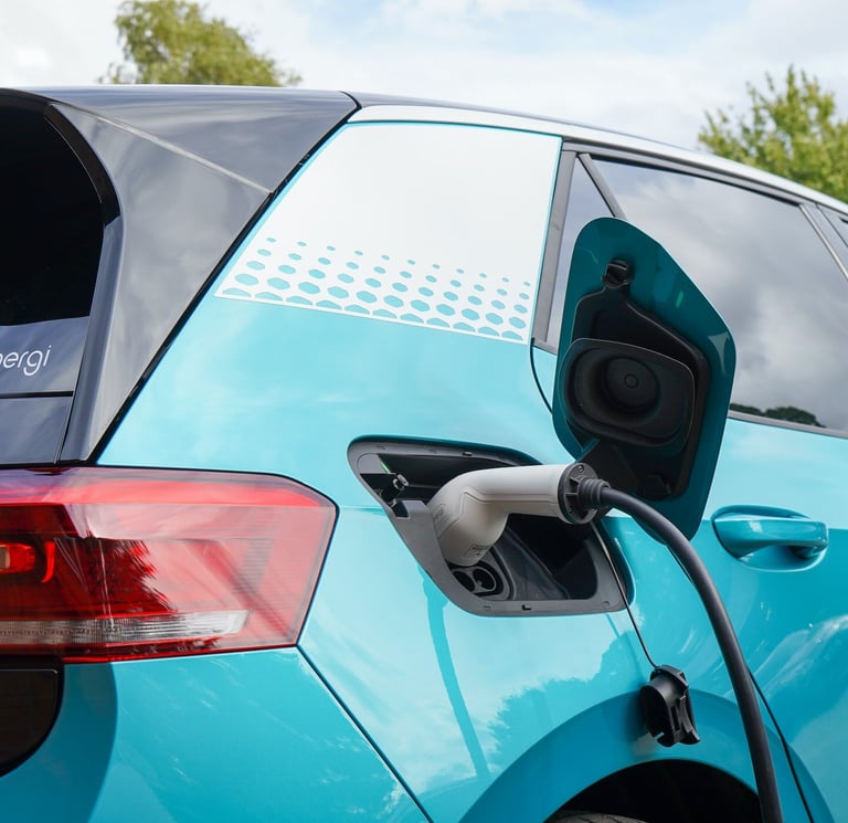 a car is shown with a charging station