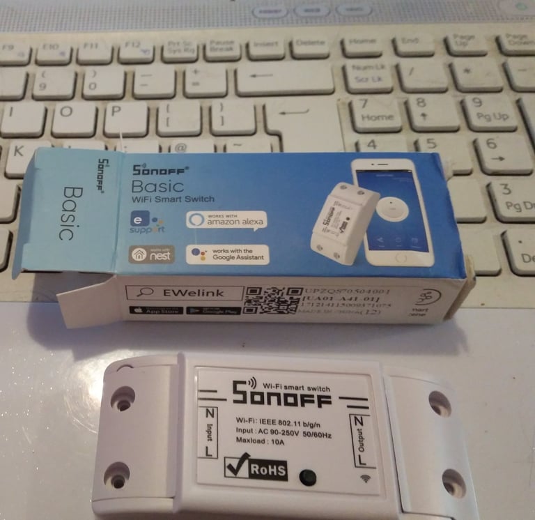 Sonoff basic WiFi smart switch and box.