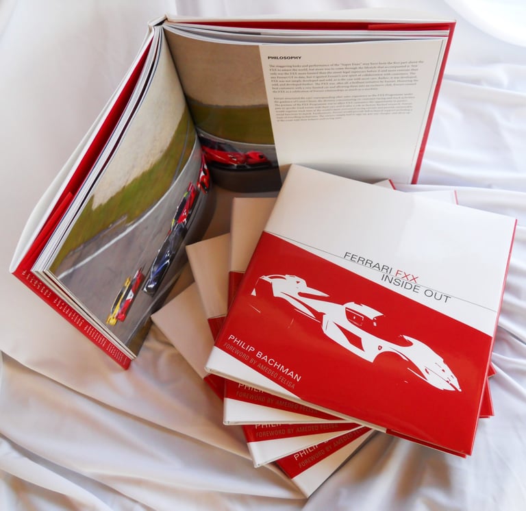 Ferrari FXX Inside Out - Book cover and stack of books