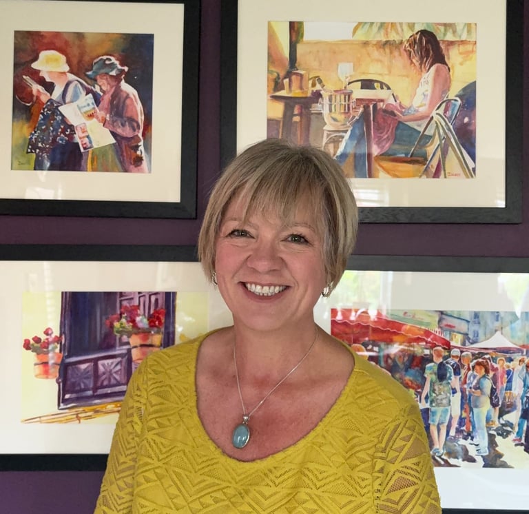 Deborah Lees infront of her paintings