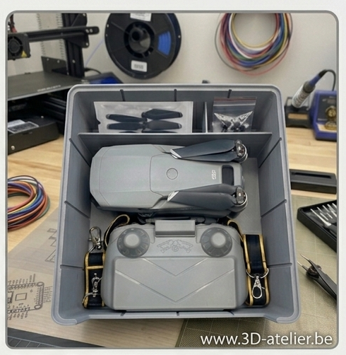 Top-down view of a tailor-made 3D printed plastic case holding a drone, remote controller, and prope