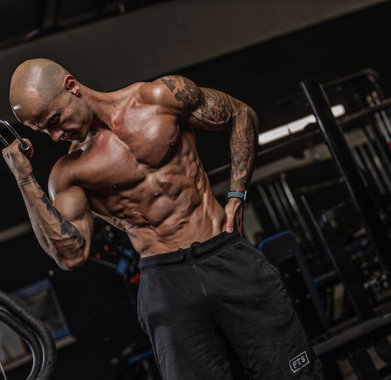 Coach Anderson, East London personal trainer, shredded man and abs