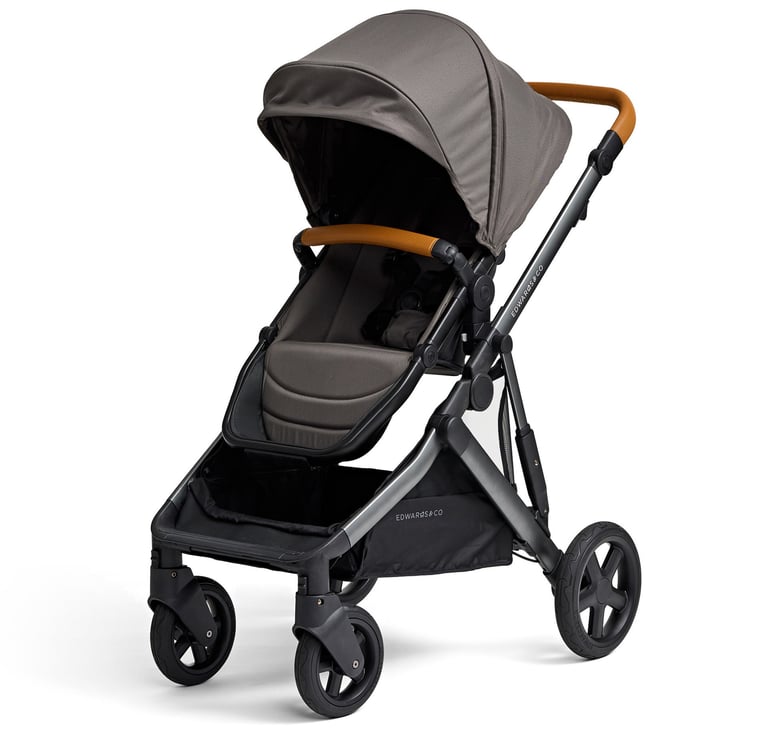 Product photography - a black stroller with brown leather straps
