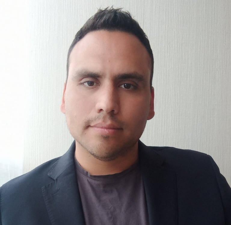 a man in a suit and tie is posing for a picture