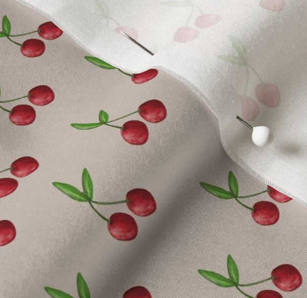 a close up of a fabric covered fabric with cherries and cherries