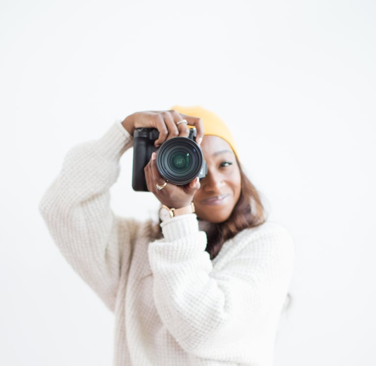 Portrait of Shade holding a camera