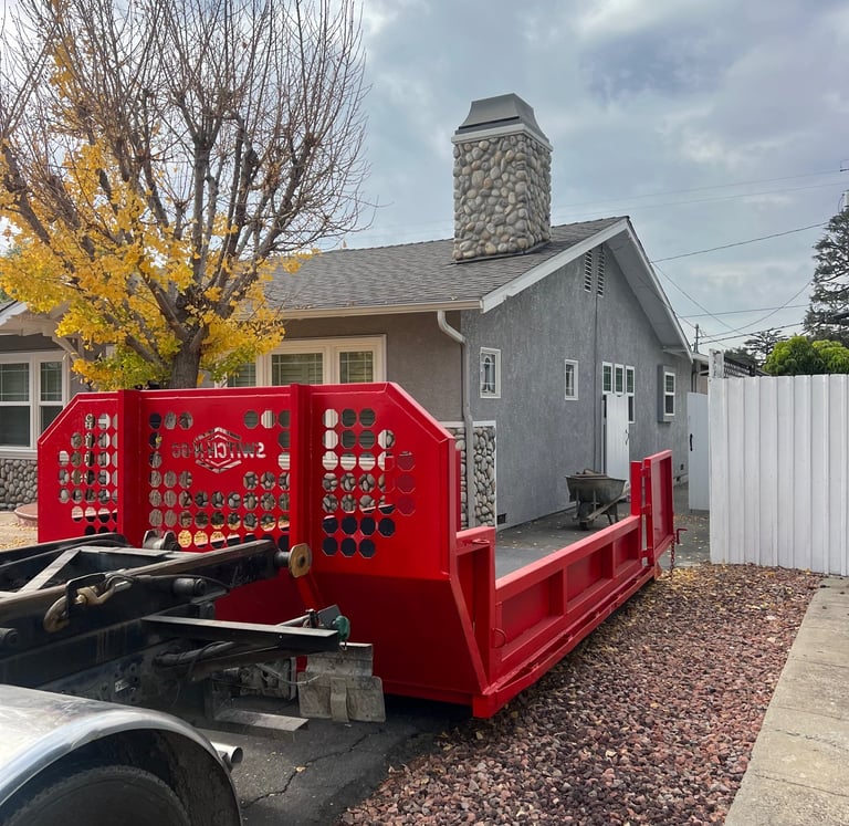 Our 5 ton lowboys are red in color and will take concrete, tile, rocks, and mix materials.